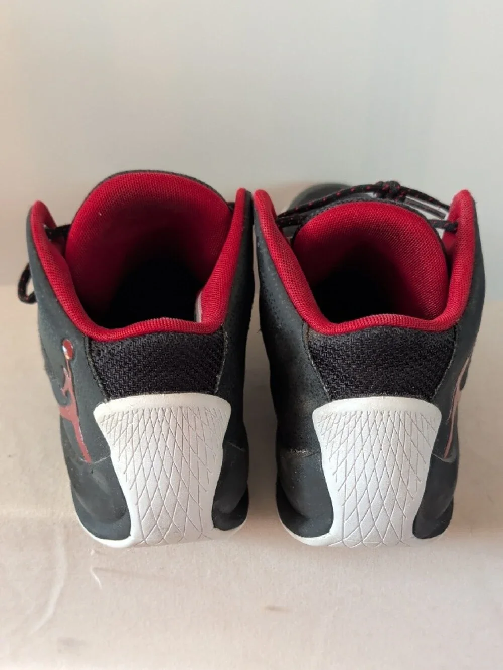 Jordan Men’s Black and Red High-Top Athletic Basketball Shoes.